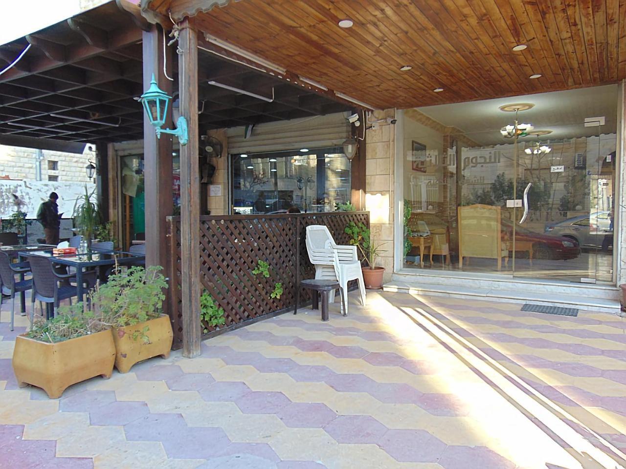 Al-Nujoom Hotel Suites Amán Exterior foto